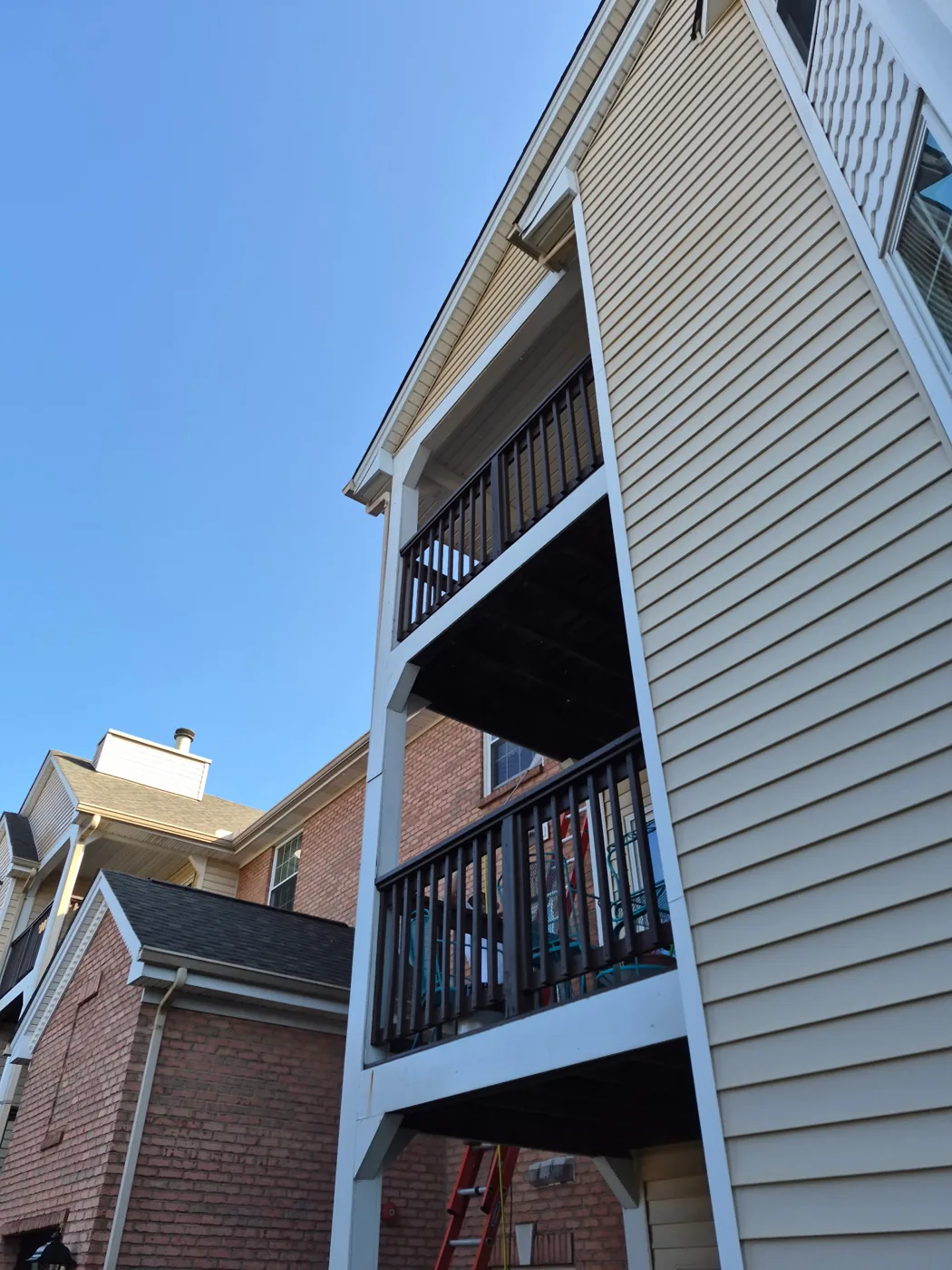 Multifamily building exterior with balcony railings, from the crew work portfolio